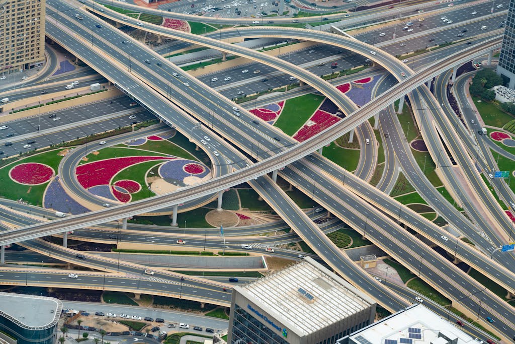 Aerial view of a complex highway interchange in Dubai, showcasing modern urban infrastructure.
